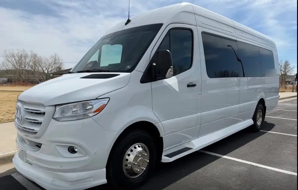 Longmont 16 passenger white Sprinter limo bus
