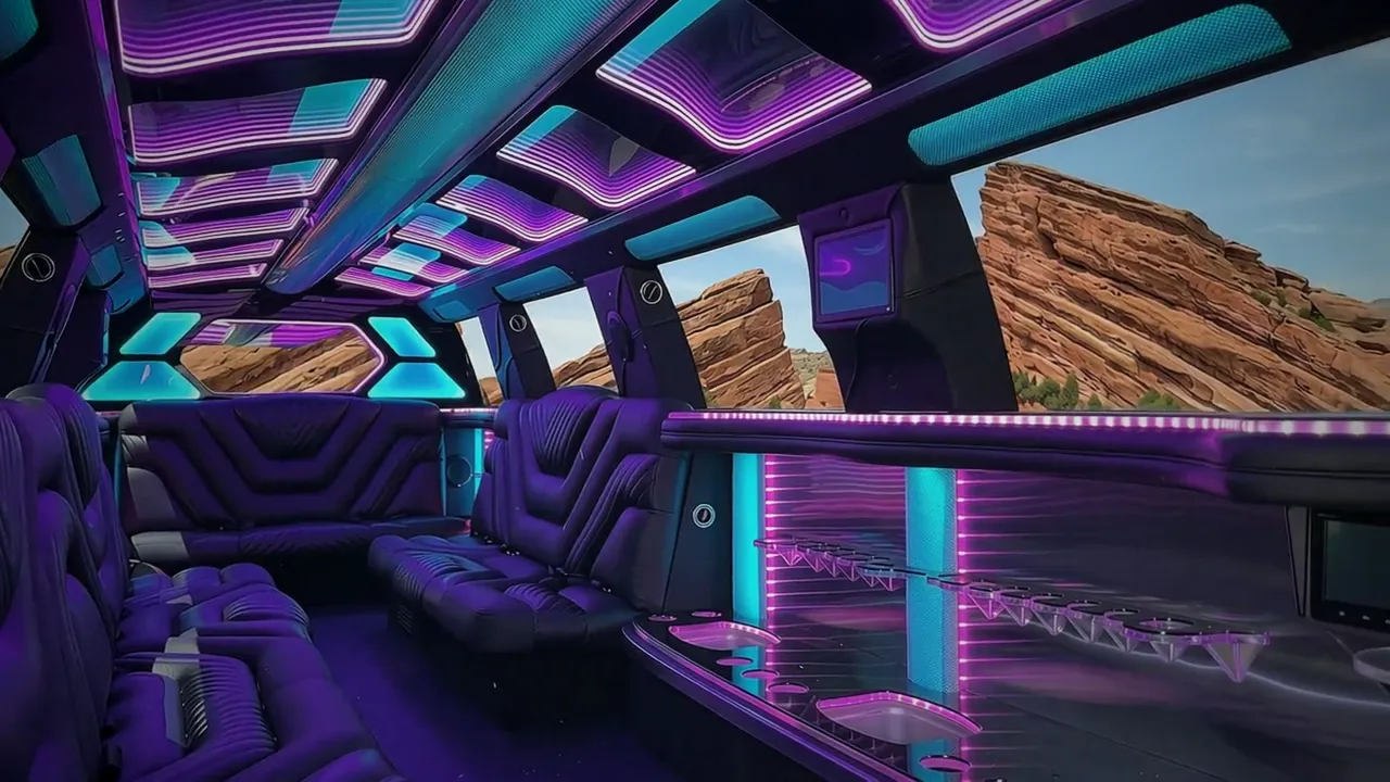 Chevy Suburban stretch limo interior with color-changing lights and wrap-around leather seating
