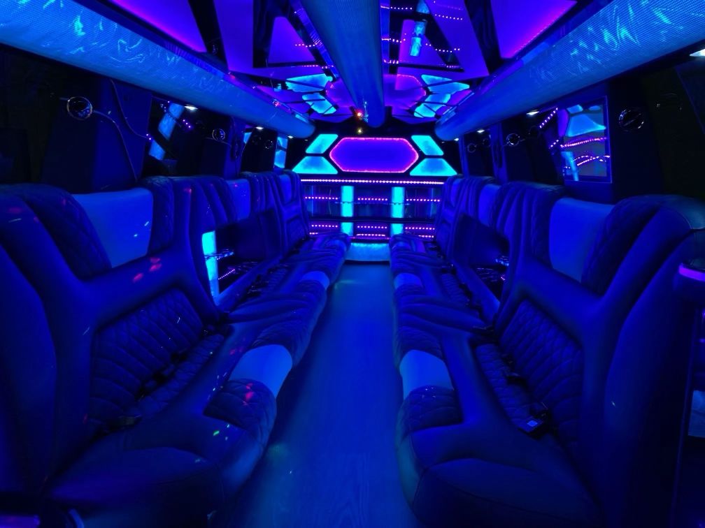 Escalade stretch limo interior with LED lighting and bar for quinceanera